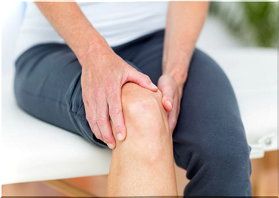 Man Touching Knee: Knee Osteoarthritis