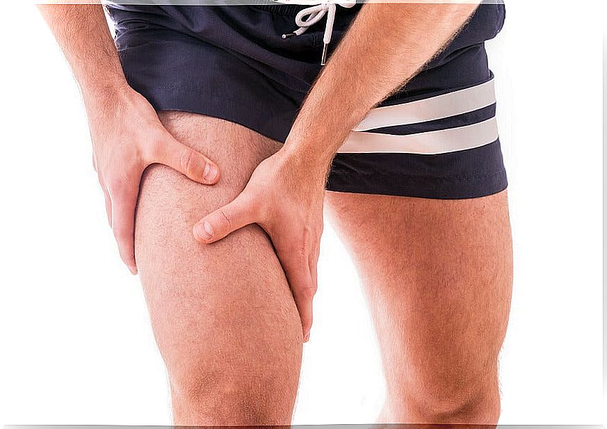 Man with hands on quadriceps