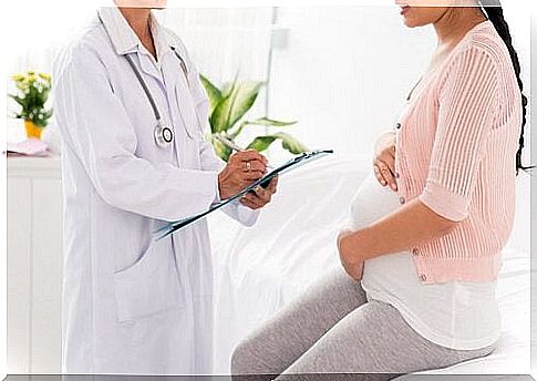 Pregnant woman at the doctor for prenatal massage