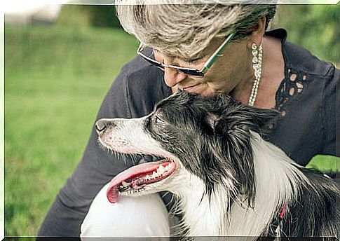 woman with her dog symbolizing how to find happiness when everything seems to be against you