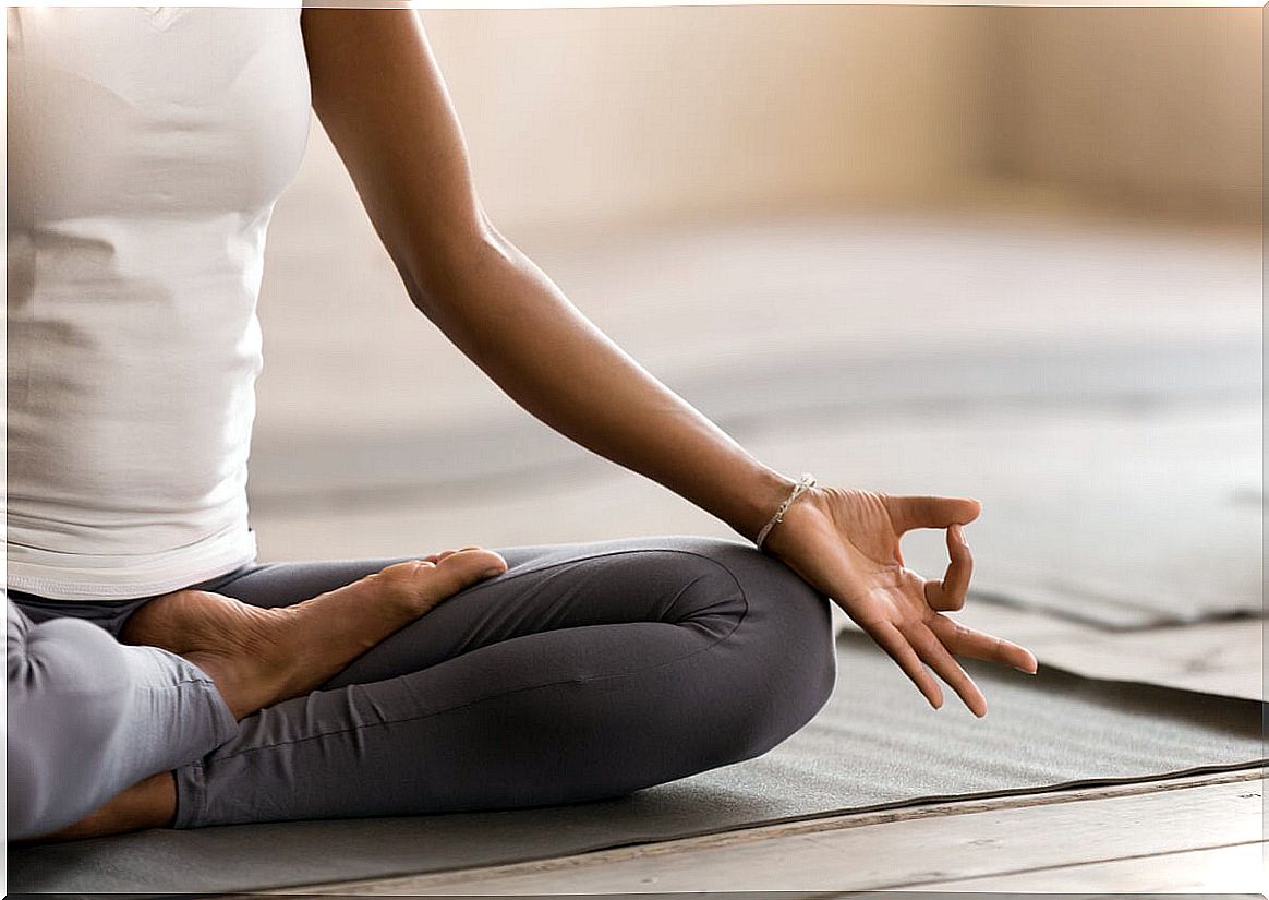 Woman meditates at home.