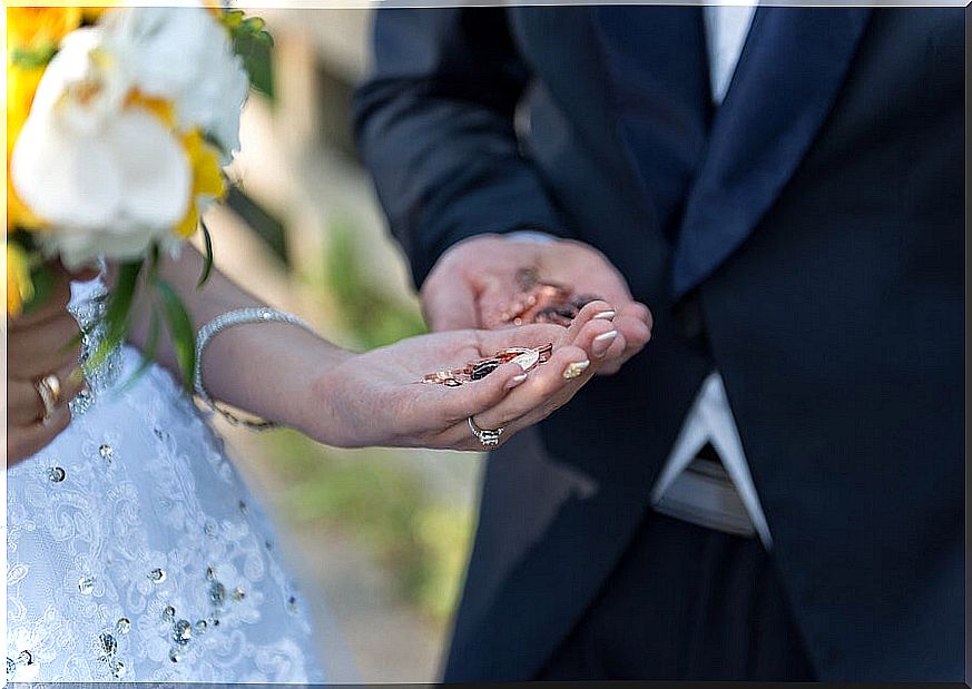 Couple getting married with the earnest in hand