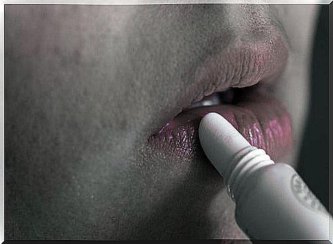 person moisturizing lips