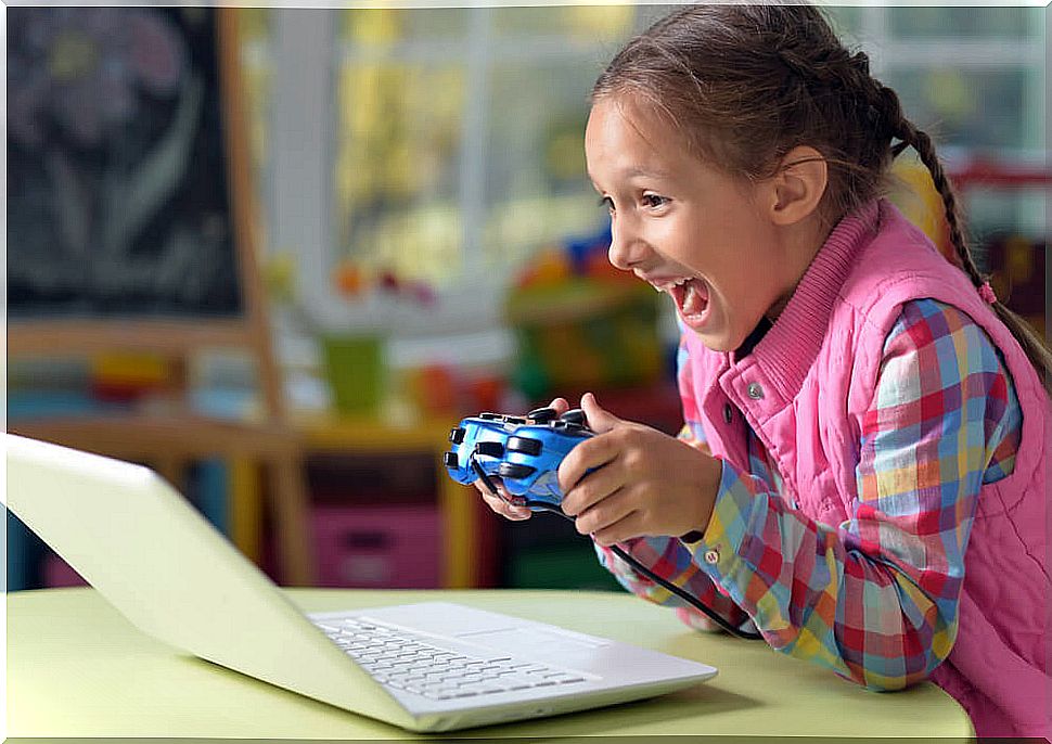 girl playing video games with her computer