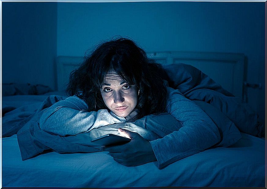 Girl with insomnia with mobile.