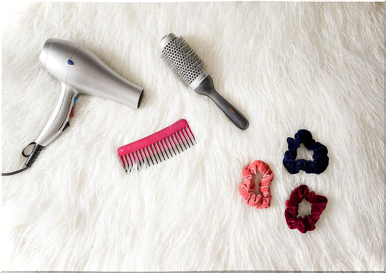 Hair dryer, brush and pigtails.